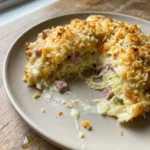 A close-up of the baked cabbage casserole with a golden breadcrumb topping.